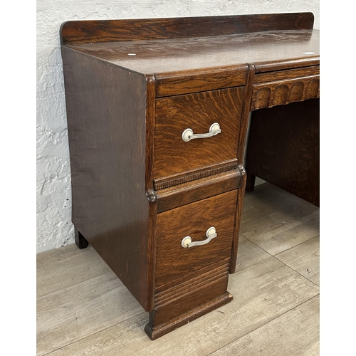 89 - An Art Deco carved oak dressing table - approx. 71cm high x 106cm wide x 46cm deep