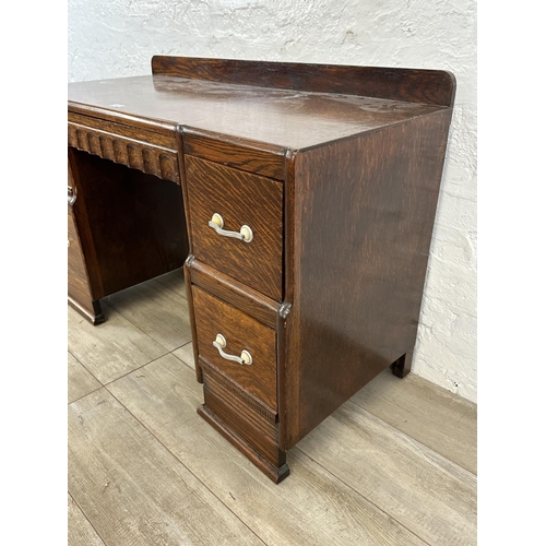 89 - An Art Deco carved oak dressing table - approx. 71cm high x 106cm wide x 46cm deep