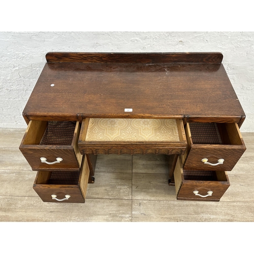 89 - An Art Deco carved oak dressing table - approx. 71cm high x 106cm wide x 46cm deep