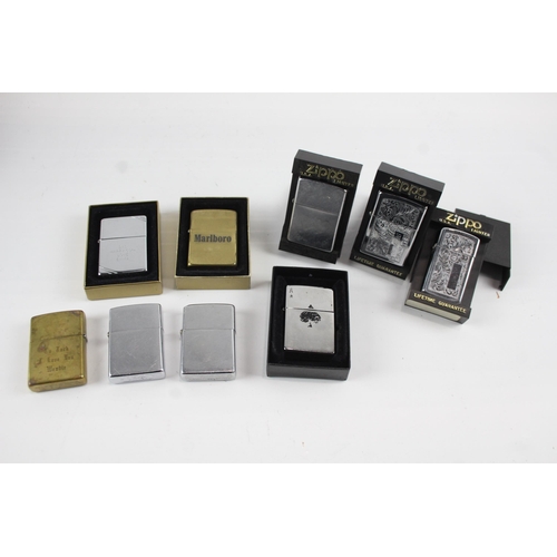 2261 - Nine Zippo cigarette lighters to include Marlboro, brass etc.