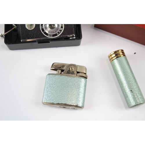 2264 - Four vintage novelty cigarette lighters