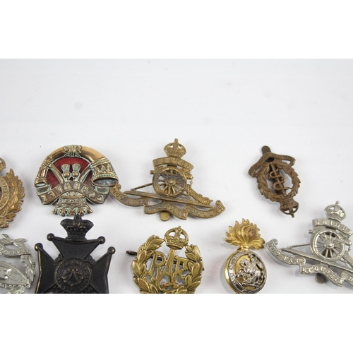 2275 - Ten military cap badges