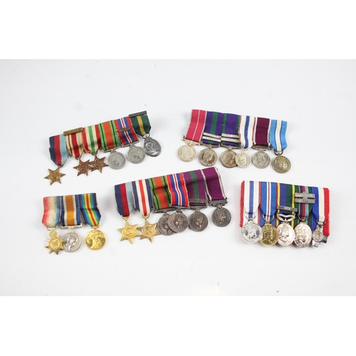 2285 - Five mounted miniature medal groups to include WWI trio, WWII, Elizabeth II B.E.M. Silver Jubilee et... 