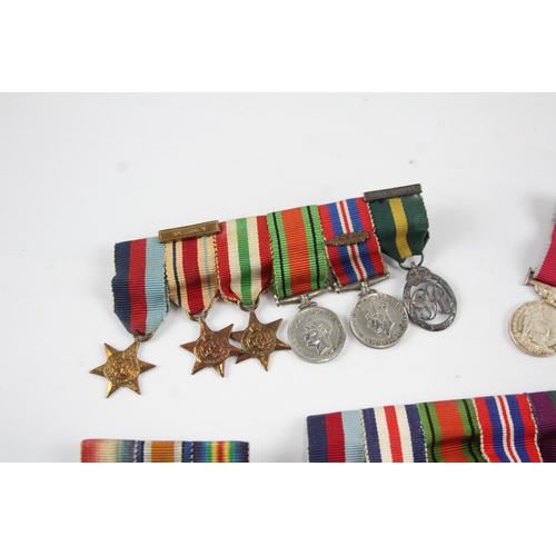 2285 - Five mounted miniature medal groups to include WWI trio, WWII, Elizabeth II B.E.M. Silver Jubilee et... 