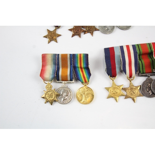 2285 - Five mounted miniature medal groups to include WWI trio, WWII, Elizabeth II B.E.M. Silver Jubilee et... 