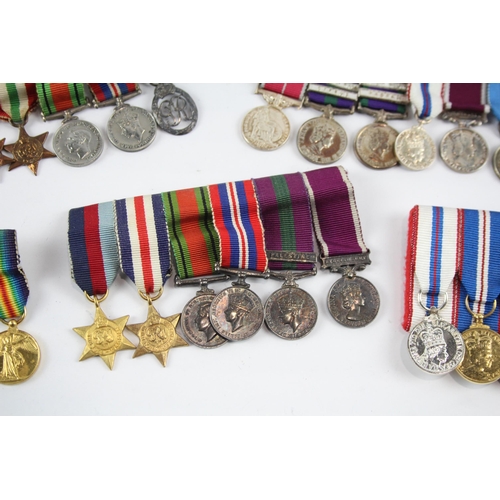 2285 - Five mounted miniature medal groups to include WWI trio, WWII, Elizabeth II B.E.M. Silver Jubilee et... 