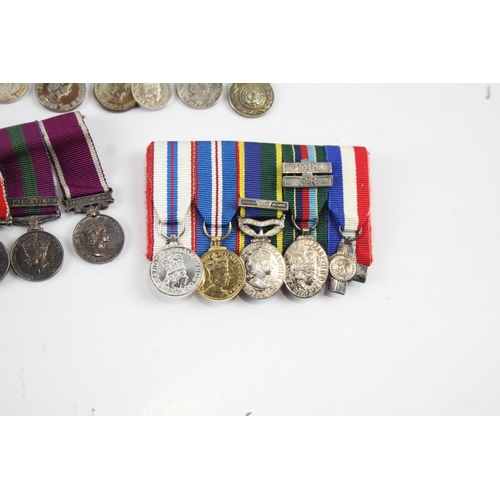 2285 - Five mounted miniature medal groups to include WWI trio, WWII, Elizabeth II B.E.M. Silver Jubilee et... 