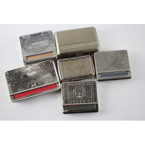 545 - Six vintage metal cigarette rolling machines/tins