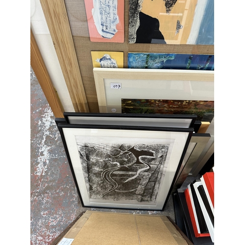 1129 - A large quantity of framed pictures and canvases