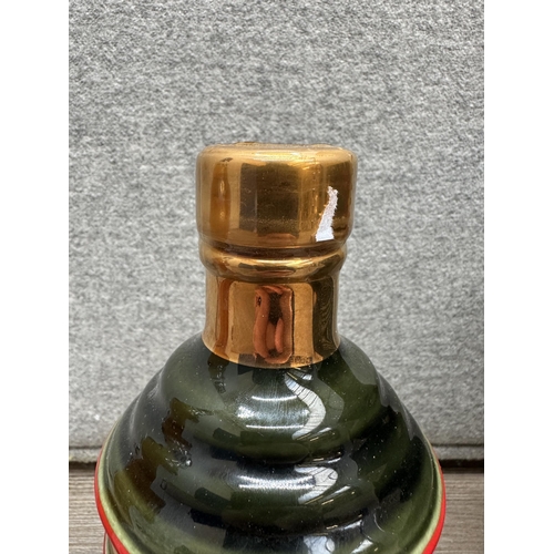 601 - Two bottles of Bell's blended Scotch whisky, one boxed 75cl 1990 Wade Christmas decanter Extra Speci... 