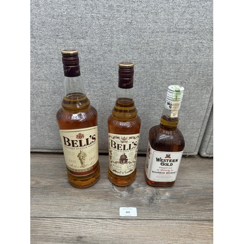 602 - Three bottles of whiskey, one 1L Bell's blended Scotch, one 70cl Bell's blended Scotch Limited Editi... 