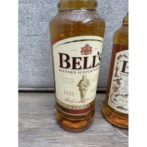 602 - Three bottles of whiskey, one 1L Bell's blended Scotch, one 70cl Bell's blended Scotch Limited Editi... 