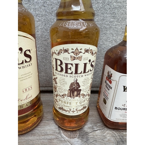 602 - Three bottles of whiskey, one 1L Bell's blended Scotch, one 70cl Bell's blended Scotch Limited Editi... 