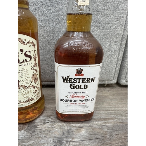 602 - Three bottles of whiskey, one 1L Bell's blended Scotch, one 70cl Bell's blended Scotch Limited Editi... 