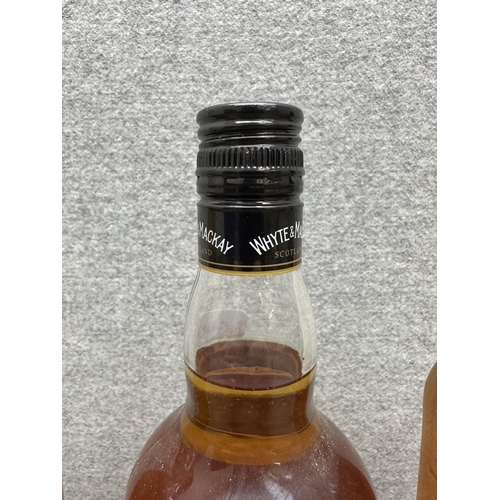 604 - Three 70cl bottles of blended Scotch whisky, one Teacher's Highland Cream, one Whyte & Mackay and on... 