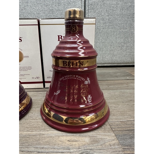 606A - Three boxed 70cl Wade Christmas decanters of Bell's Extra Special Old blended Scotch whisky, 1999, 2... 