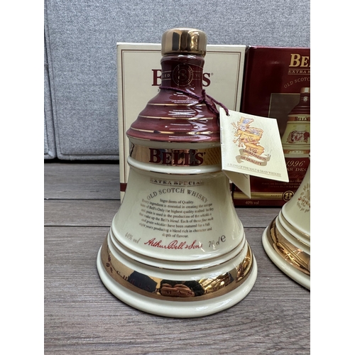 606B - Three boxed 70cl Wade Christmas decanters of Bell's Extra Special Old blended Scotch whisky, 1996, 1... 