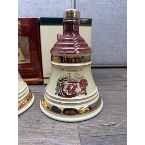 606B - Three boxed 70cl Wade Christmas decanters of Bell's Extra Special Old blended Scotch whisky, 1996, 1... 