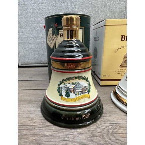 606D - Two boxed Wade Christmas decanters of Bell's blended Scotch whisky, one 1990 75cl Extra Special Old ... 