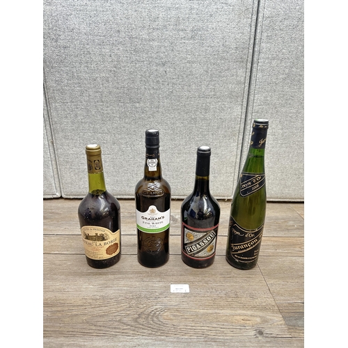 606I - Four 75cl bottles, one Graham's Fine White Port, one 2012 Pigassou French red wine, one 1984 Château... 