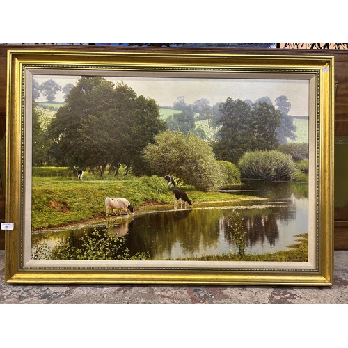 A gilt framed David Smith oil on canvas of cattle by a stream, titled 'Lower R. Dove near Church Mayfield Derbyshire' - approx. 74cm high x 103cm wide