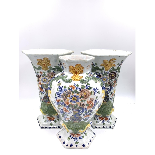 375 - Three antique Delft polychrome floral decorated vases, two approx. 26.5cm high and one approx. 26cm ... 