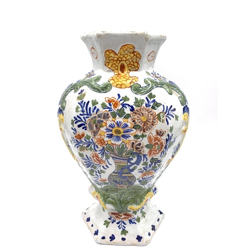 375 - Three antique Delft polychrome floral decorated vases, two approx. 26.5cm high and one approx. 26cm ... 