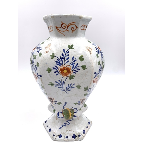 375 - Three antique Delft polychrome floral decorated vases, two approx. 26.5cm high and one approx. 26cm ... 