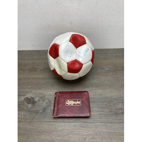 511 - A signed Stoke City Football Club football and autograph album to include signatures by Gordon Banks... 