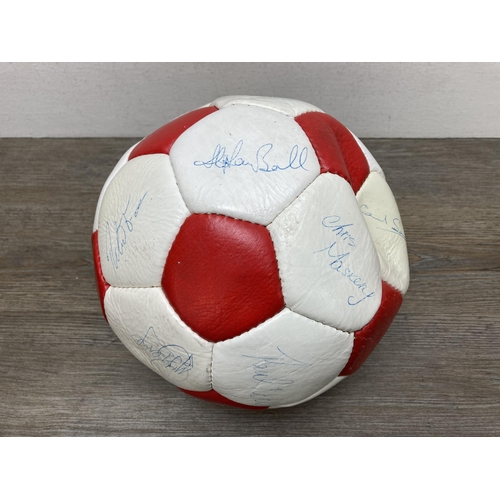 511 - A signed Stoke City Football Club football and autograph album to include signatures by Gordon Banks... 