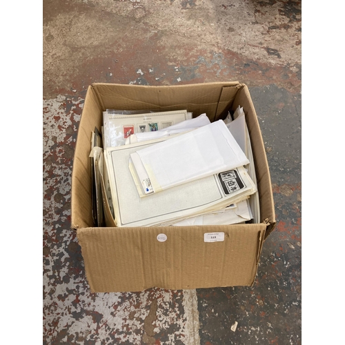 519 - A box containing a large collection of worldwide stamps and first day covers