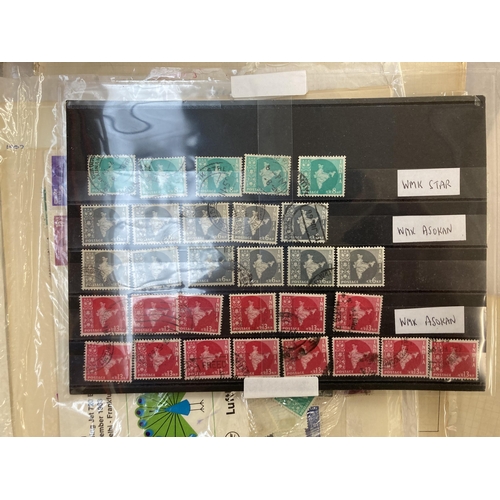 519 - A box containing a large collection of worldwide stamps and first day covers