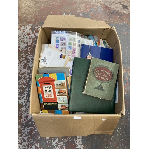 521 - A box containing a large collection of worldwide stamps and first day covers