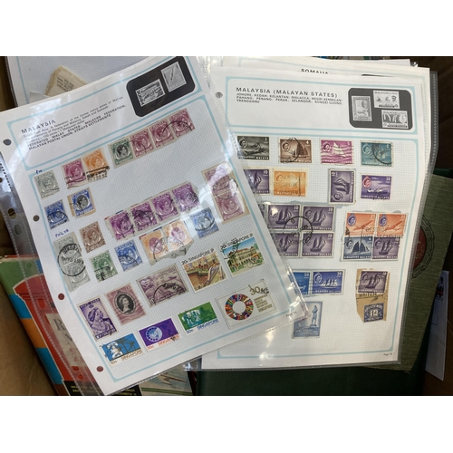 521 - A box containing a large collection of worldwide stamps and first day covers