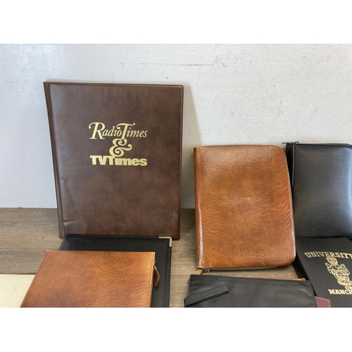 544 - A collection of leather and leatherette accessories to include notebook, clipboard holder, wallets e... 