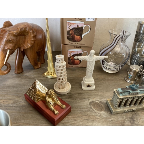 553 - Various collectables to include three boxed Leonardo Collection stag fine china mugs, carved teak el... 