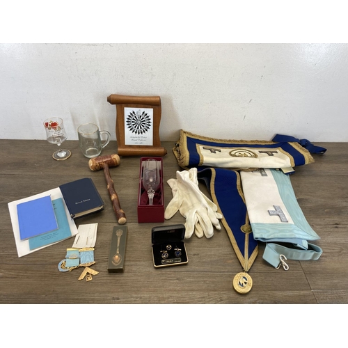 555 - A collection of masonic regalia to include Josiah Wedgwood Lodge jewels, sashes, books, presentation... 