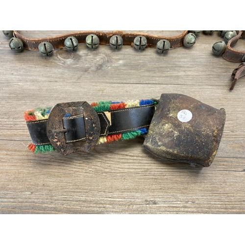 558 - A set of late/early 20th century brown leather and cast metal sleigh bells together with a vintage S... 