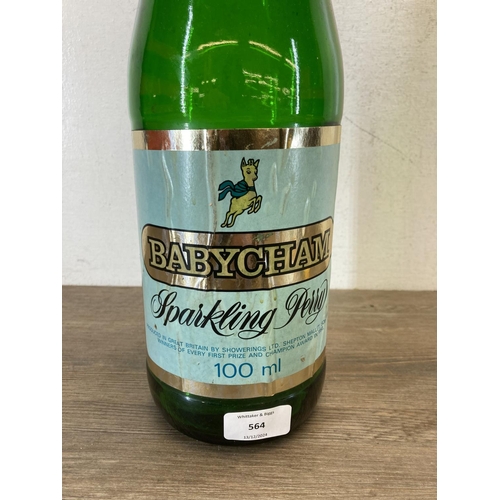 564 - Three mid 20th century Babycham advertising collectables, one green glass money bottle and two plast... 