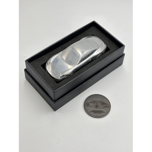 2256 - A boxed Porsche 911 Carrera S limited edition model/ paperweight with medallion