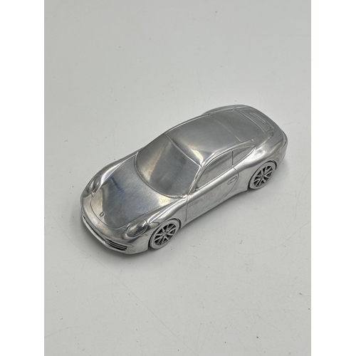 2256 - A boxed Porsche 911 Carrera S limited edition model/ paperweight with medallion