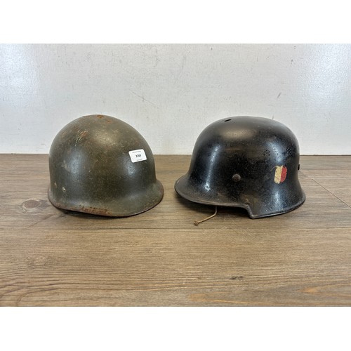 2269 - Two German helmets, one M34 Fire Police and one post war