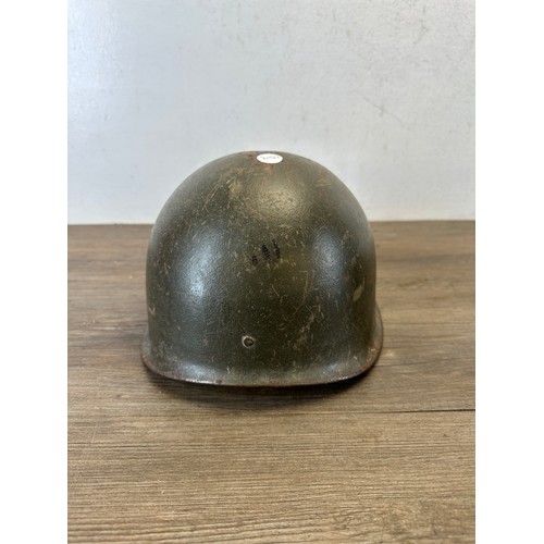 2269 - Two German helmets, one M34 Fire Police and one post war