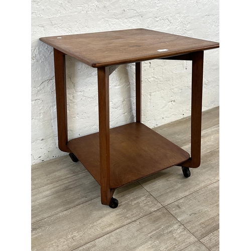 1 - A mid 20th century teak two tier serving trolley - approx. 60cm high x 53cm wide x 53cm deep