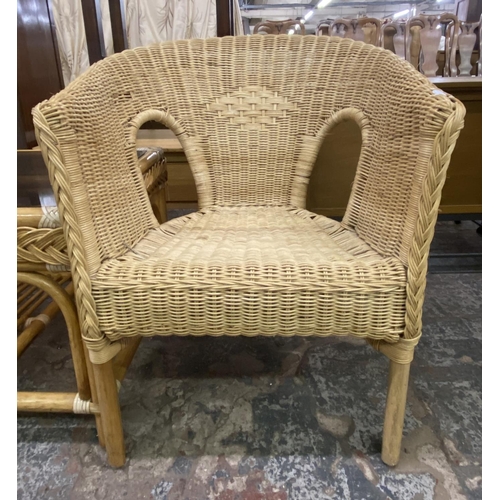 105 - Four pieces of wicker and cane furniture, two glass top coffee tables and two armchairs