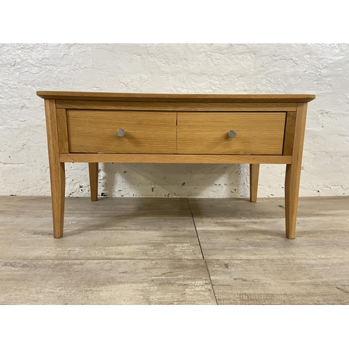 111 - A contemporary oak coffee table - approx. 43cm high x 45cm wide x 80cm long