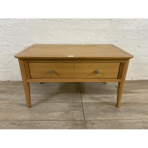 111 - A contemporary oak coffee table - approx. 43cm high x 45cm wide x 80cm long