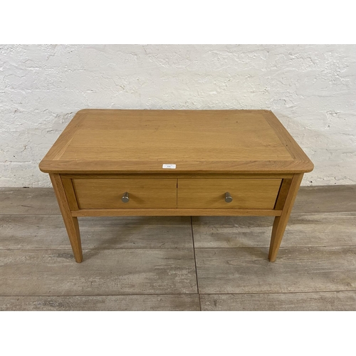 111 - A contemporary oak coffee table - approx. 43cm high x 45cm wide x 80cm long