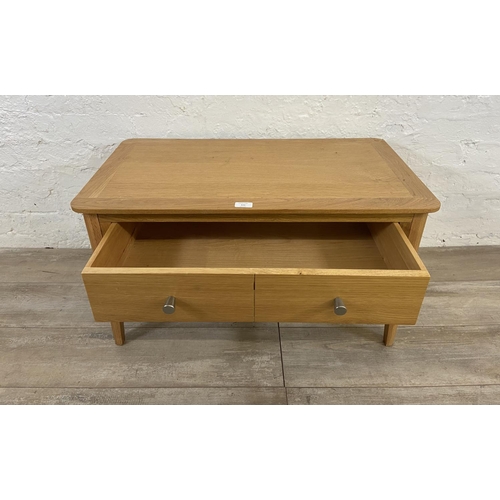 111 - A contemporary oak coffee table - approx. 43cm high x 45cm wide x 80cm long