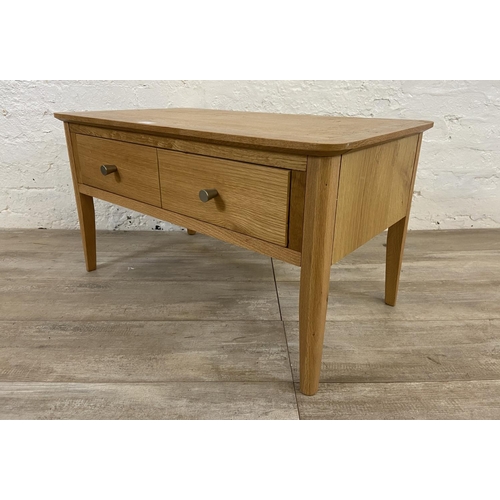 111 - A contemporary oak coffee table - approx. 43cm high x 45cm wide x 80cm long